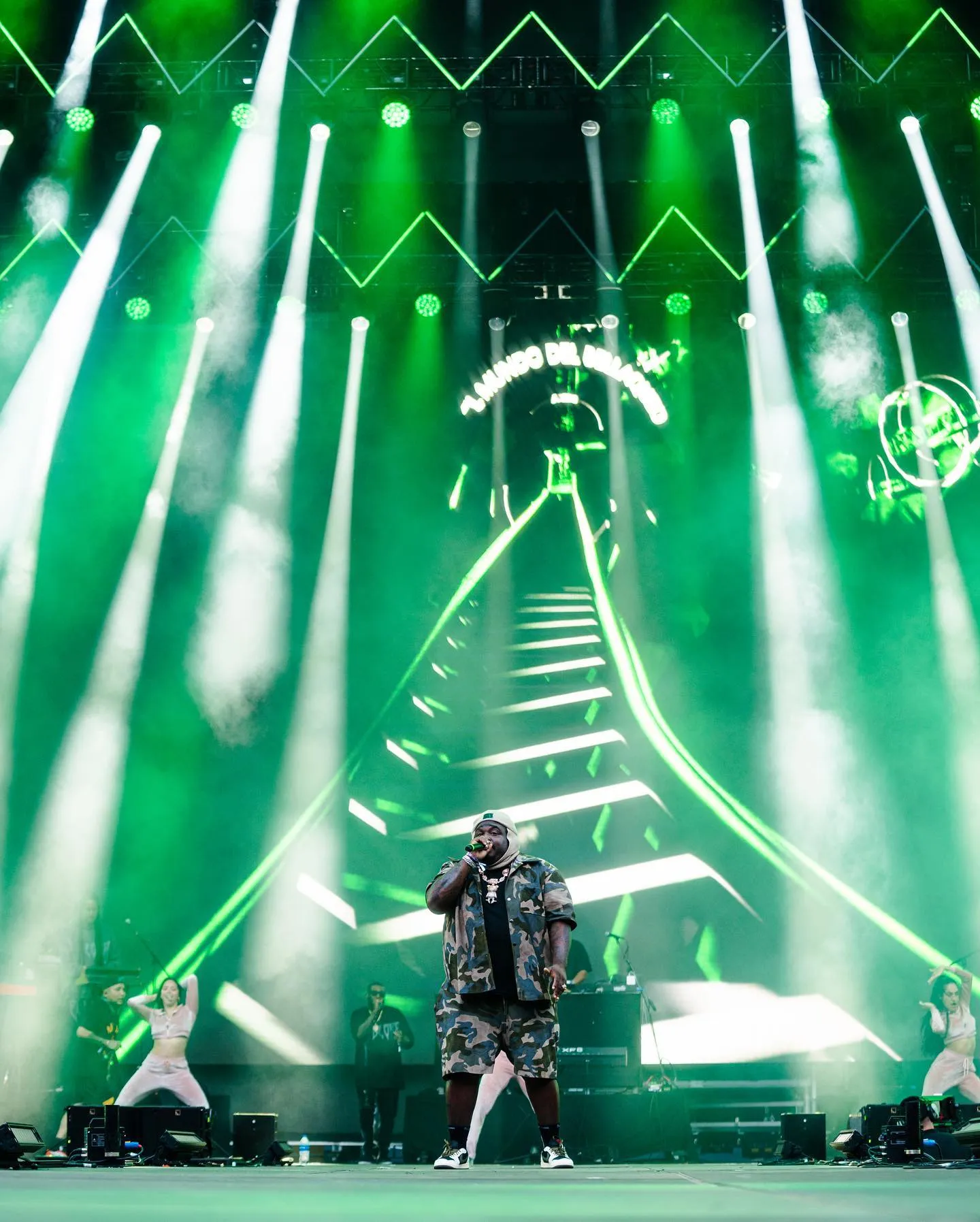 Sech performing in Miami in front of the roller coaster visuals on the LED wall